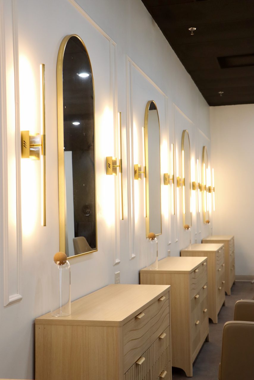 Arched styling stations inside The Quin Hair Salon & Spa